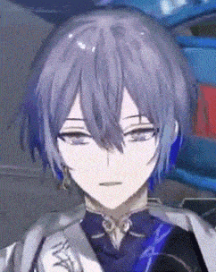 a close up of a person with purple hair and blue earrings .