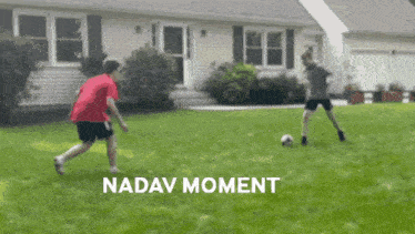 two boys are playing soccer in front of a house and the words nadav moment are visible