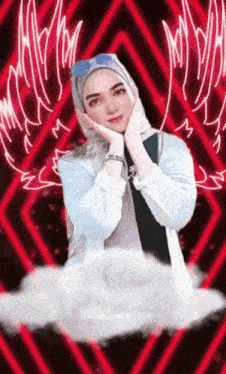 a woman wearing a hijab and sunglasses is standing in front of a red background