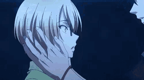a couple of anime characters touching each other 's faces in a dark room
