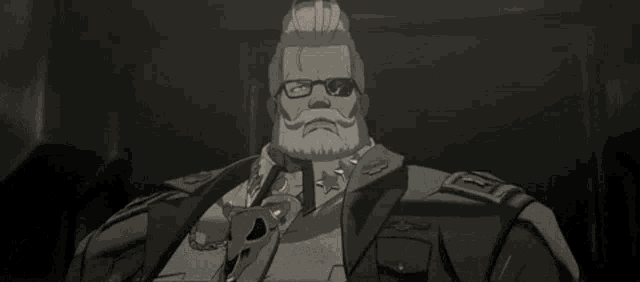 a man with glasses and a beard is talking about the hell