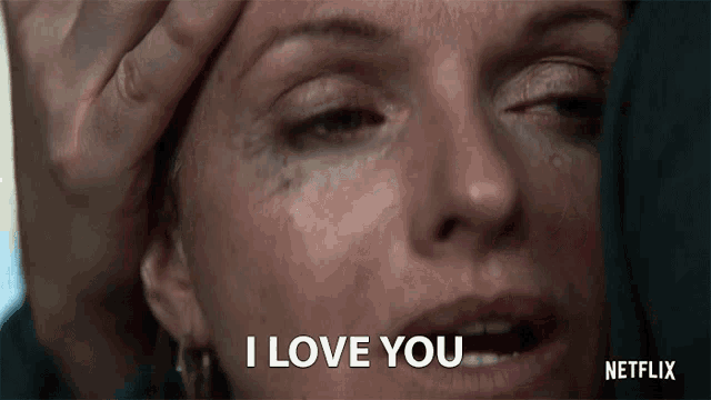 a close up of a woman 's face with the words " i love you " on the bottom