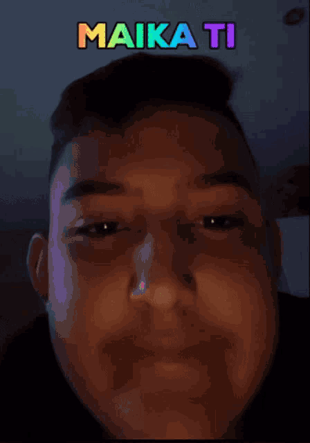 a man 's face is shown with the words " maika ti " written above it