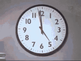 a clock on a wall that shows the time as 4:20