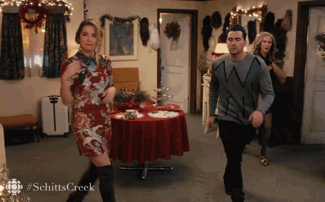 a scene from schitts creek shows a woman dancing