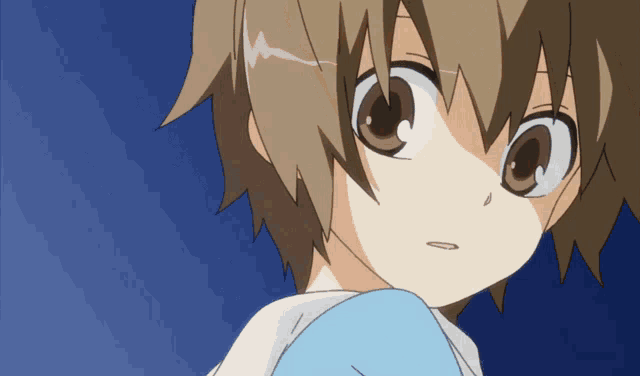 a close up of a cartoon character with brown hair