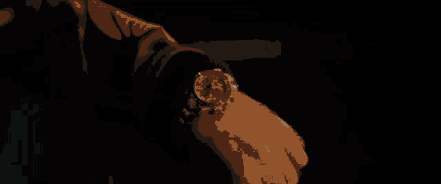a rolex watch is surrounded by a glowing circle