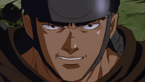 a close up of a man 's face with a helmet on his head