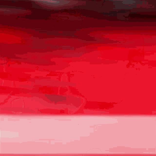 a red background with a white border and a red sky