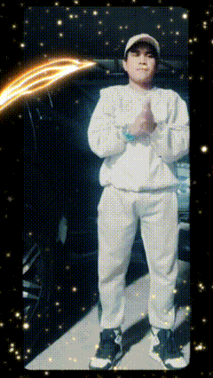 a man in white pants and a hat stands in front of a black background with stars