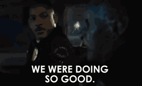 a man is sitting in the back seat of a car talking to another man and saying `` we were doing so good . ''