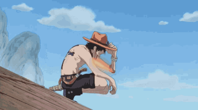 a man in a hat is kneeling on a wooden surface with a sword in his hand