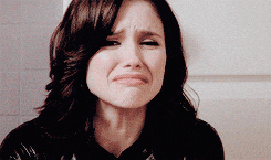 a woman making a sad face with her mouth open