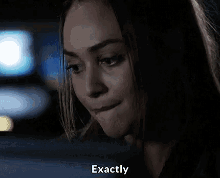 a close up of a woman 's face with the words exactly below it