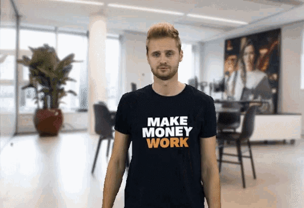 a man wears a black shirt that says make money work