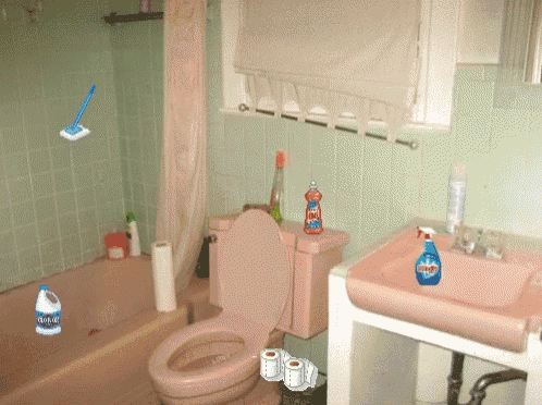 a bathroom with a toilet and a sink and a bottle of clorox