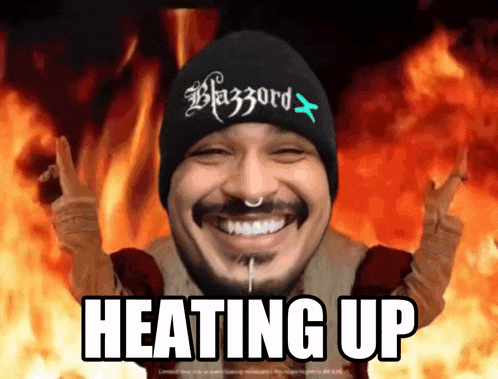 a man wearing a beanie that says blazzard is heating up