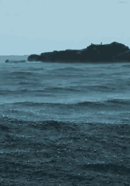 a person standing on a rock in the middle of the ocean with the words agreeing below them