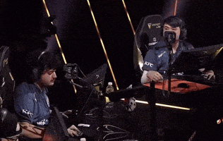 a man wearing a headset talks into a microphone
