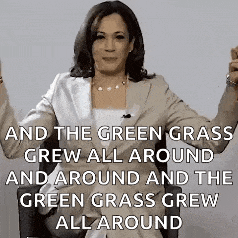 a woman in a suit is sitting in a chair with her arms in the air and a quote .