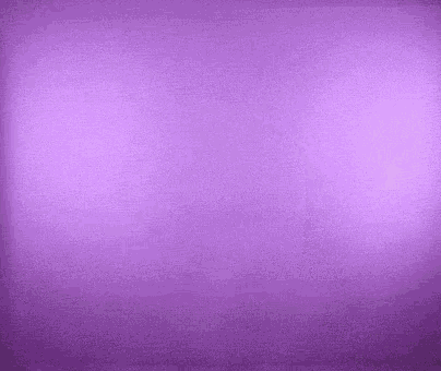 a person is standing in front of a purple wall holding a purple object .