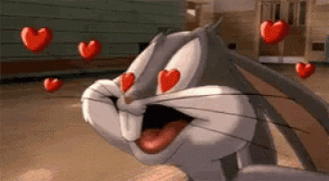 bugs bunny from looney tunes is surrounded by red hearts in his eyes .