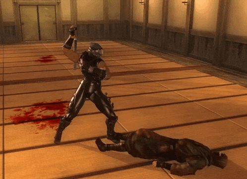 a video game shows a ninja fighting another ninja on the floor