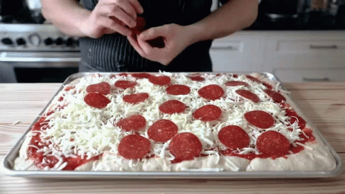 Adding Pepperoni Joshua Weissman GIF - Adding Pepperoni Joshua Weissman Homemade Pizza GIFs