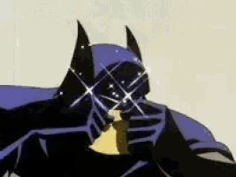 a close up of a cartoon character wearing a batman mask and holding a banana .