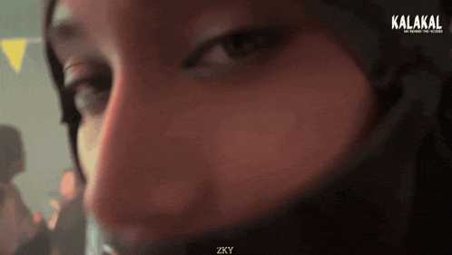 a close up of a woman 's face with the words kalakal on the bottom