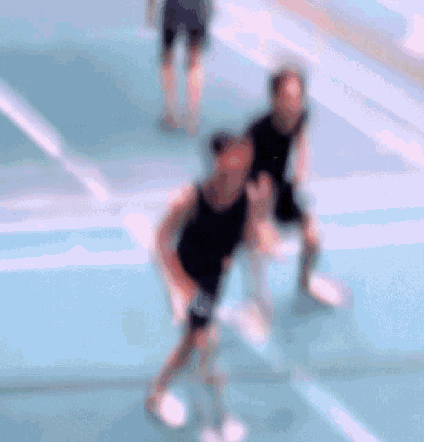 a blurry picture of a person playing basketball