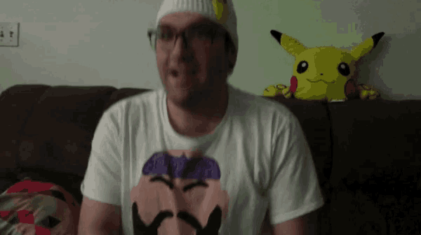 a man wearing a t-shirt with a picture of a man with a mustache