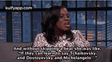 a woman is sitting on a couch and talking about dostoyevsky and michelangelo
