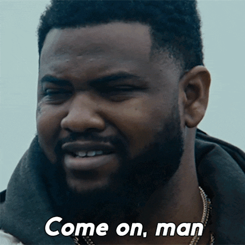 a man with a beard has the words come on man written on his face