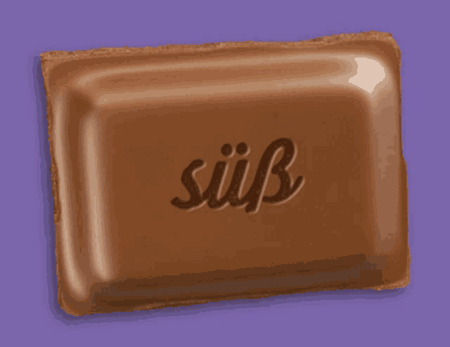 a purple background with a chocolate bar that says ' süß ' on it