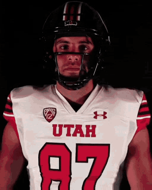 a man wearing a utah jersey and a helmet