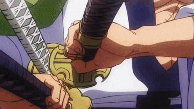 a person is holding a sword in their hand .