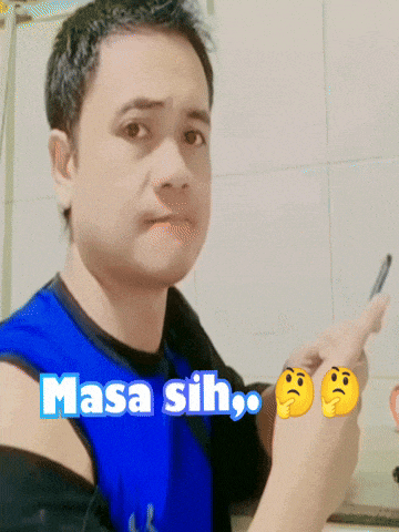 a man wearing a blue shirt with masa sih written on it holds a pen