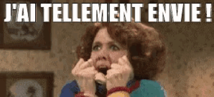 a woman with a surprised look on her face with the words j'ai tellement envie written above her