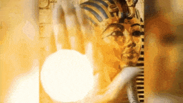 a close up of a statue of a woman 's face with a light coming out of it .