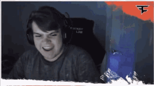 a man wearing headphones and a shirt that says e sport lab