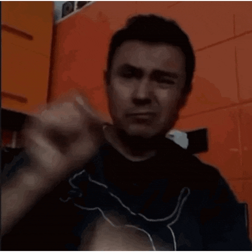 a man is holding a piece of meat in his hands