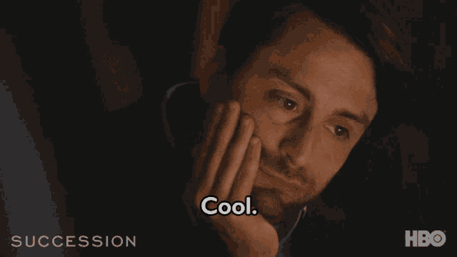 a close up of a man 's face with the words cool below him