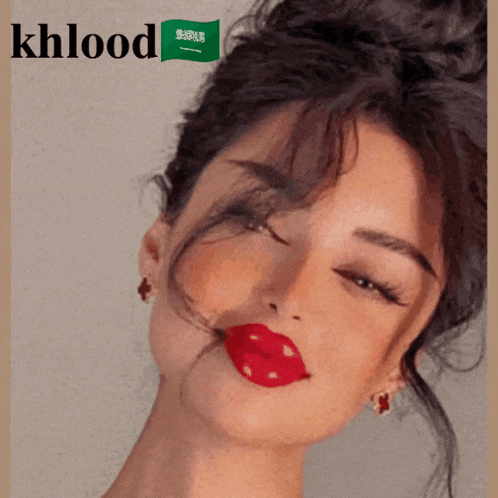 a woman with red lips and khlood written on the bottom right