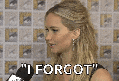 a woman speaking into a microphone with the words " i forgot " written on her face