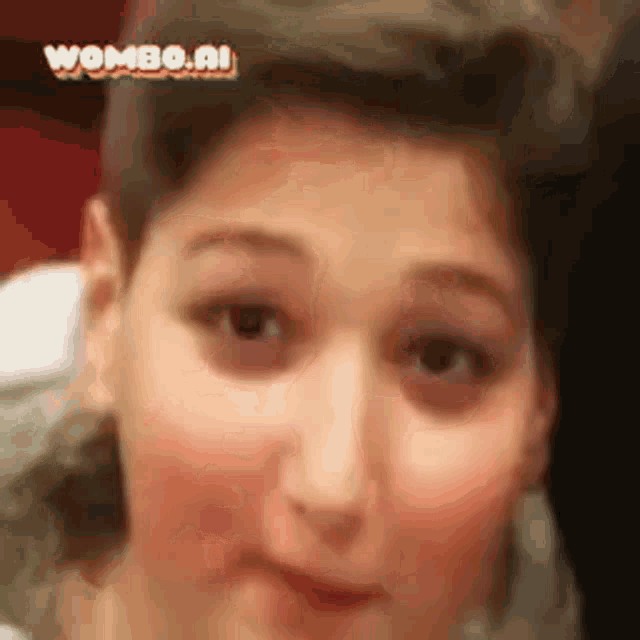 a close up of a person 's face with the words wombo.nl on the bottom .