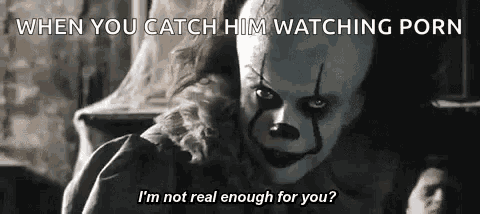pennywise the clown from it chapter two is talking to a woman in a dark room .