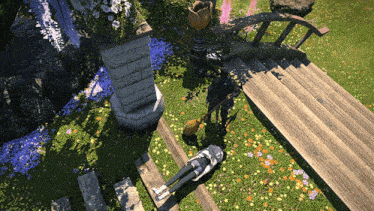 a person is laying on the grass next to a bridge