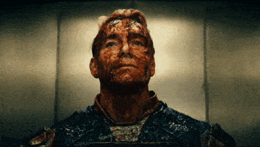 a man with blood on his face looking up