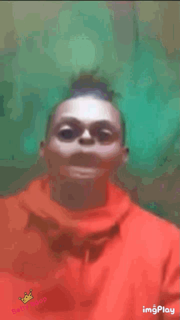 a blurry picture of a child 's face with the words imgplay on the bottom left